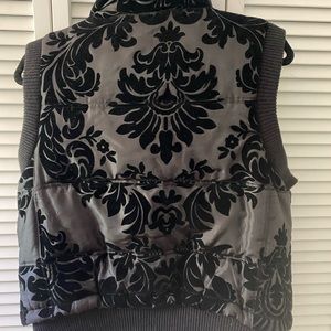 Brocade puffer vest w/ faux fur collar.